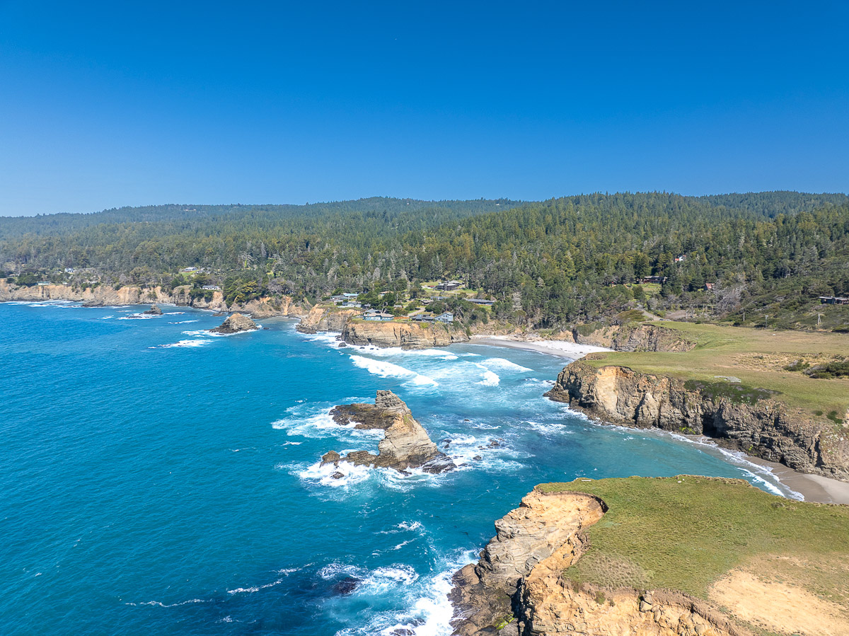 Dramatic oceanfront bluff with coves, waves, and endless coastal views.