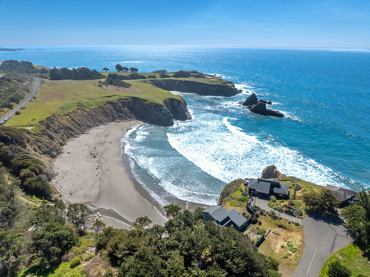Clifftop retreat with panoramic ocean views above a secluded cove