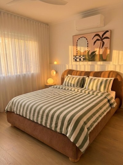 Sun-filled bedroom, warm modern style