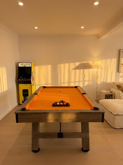 Games room with pool table and arcade