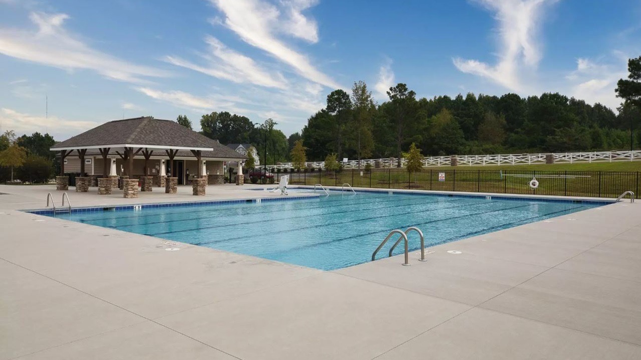 Spacious resort-style pool with covered pavilion and scenic views