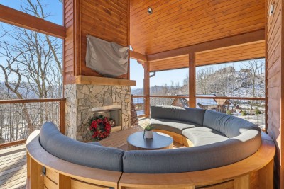 This cozy indoor lounge provides a quiet space to relax, read, or enjoy conversation while staying connected to the surrounding mountain scenery through expansive windows.