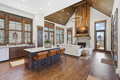 The kitchen bar offers additional seating for casual meals, coffee mornings, or socializing while cooking, seamlessly connecting the kitchen and dining areas.