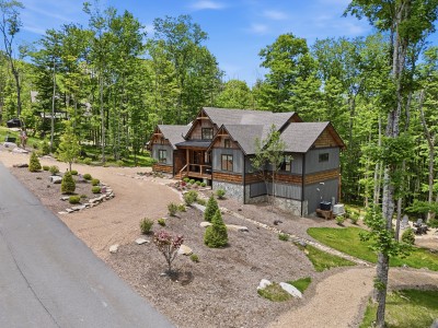 Private wooded cabin featuring rustic charm, landscaped grounds, and scenic curb appeal — a warm, inviting retreat that sets the perfect tone for a relaxing and memorable mountain getaway from the moment you arrive.