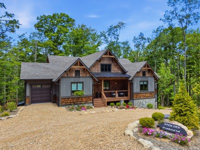 Charming woodland cabin featuring a covered porch and upscale curb appeal — a warm, inviting retreat that sets the tone for a perfect mountain getaway from the moment you arrive.