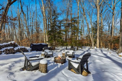 This outdoor gathering space is designed for connection and relaxation, featuring a dedicated fire pit area surrounded by comfortable seating. It’s the perfect spot for morning coffee, evening conversations, or winding down after a day of adventures.