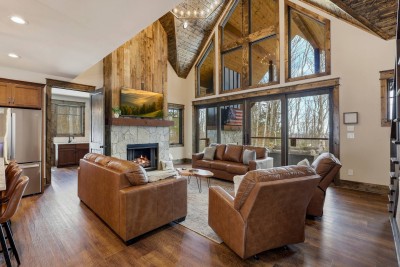 Gas Fireplace, Leather Sofas and Custom Wood Accents