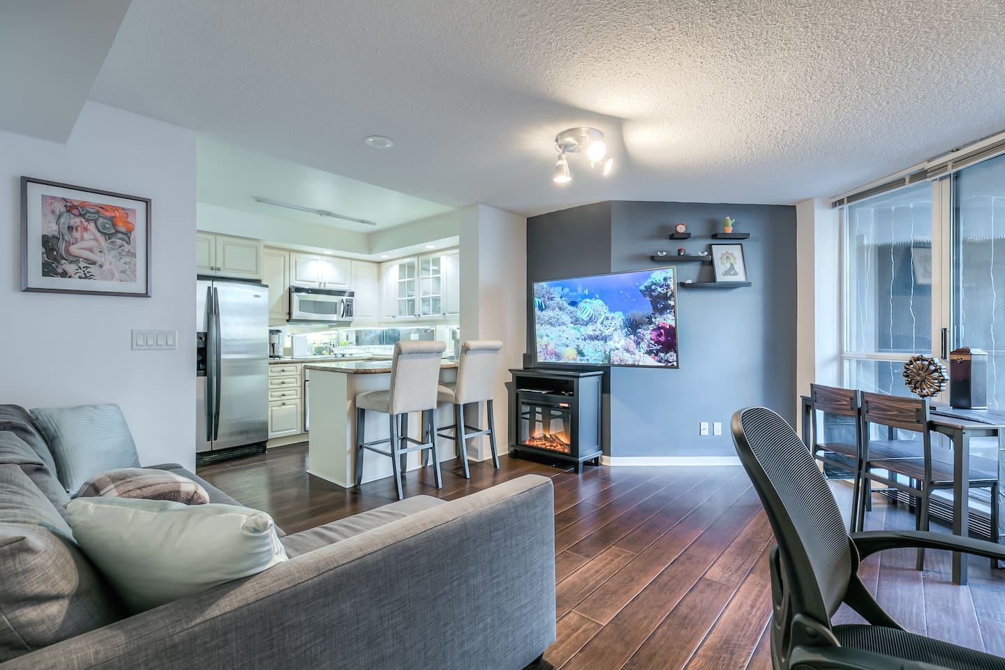 Bright, cozy space with a smart TV and comfy sofa