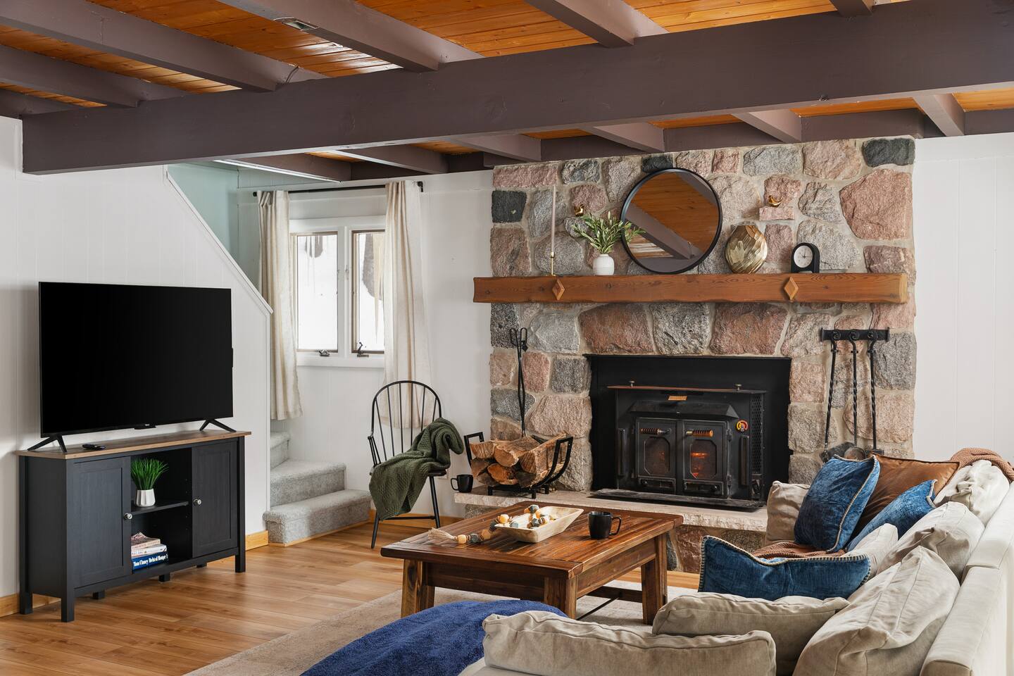 Northwoods Treehaus living room with stone fireplace