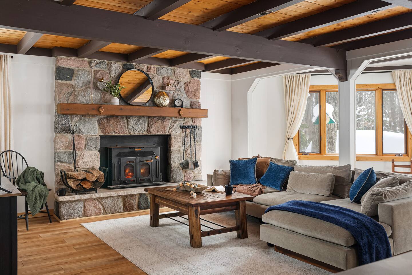 Open concept living room with stone fireplace