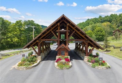 Arrive in style through this stunning covered entrance, designed like a mountain resort lodge, making every arrival feel special whether you’re checking in or heading out for the day.