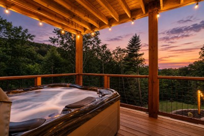 Soak in your own private hot tub, tucked beneath the covered lower deck and framed by tall hardwoods. Watch the sunset melt into layers of forest and mountain ridgeline while the cool mountain air settles in around you for the night.