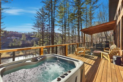 Sink into total relaxation as you soak in the private hot tub, surrounded by peaceful forest views. Steam rises as the sun sets, creating the perfect end to a day of exploring or a cozy night under the stars.