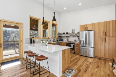 Cook, gather, and connect in this stylish kitchen designed for shared moments. The spacious island is perfect for breakfasts, cocktails, or late-night snacks while enjoying the warm wood tones and modern finishes.
