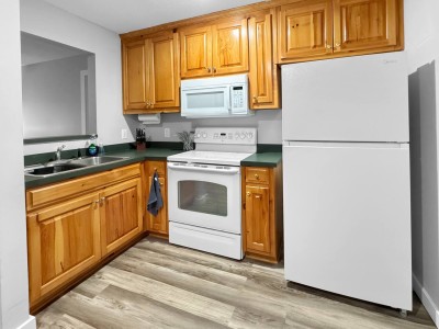 Full kitchen with stove and oven at the Nacoochee condo in Helen, GA