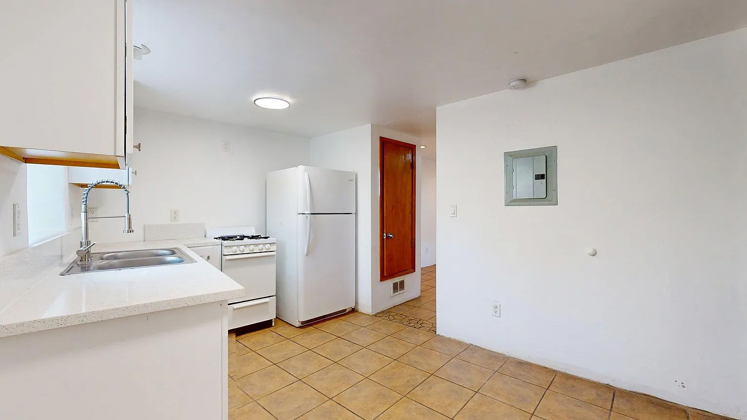Bright kitchen with full-size appliances and flexible dining space