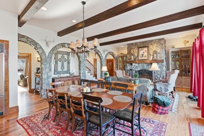 Gather everyone around the dining table for memorable meals filled with laughter and conversation. The warm wood tones and open layout make this space ideal for shared experiences.