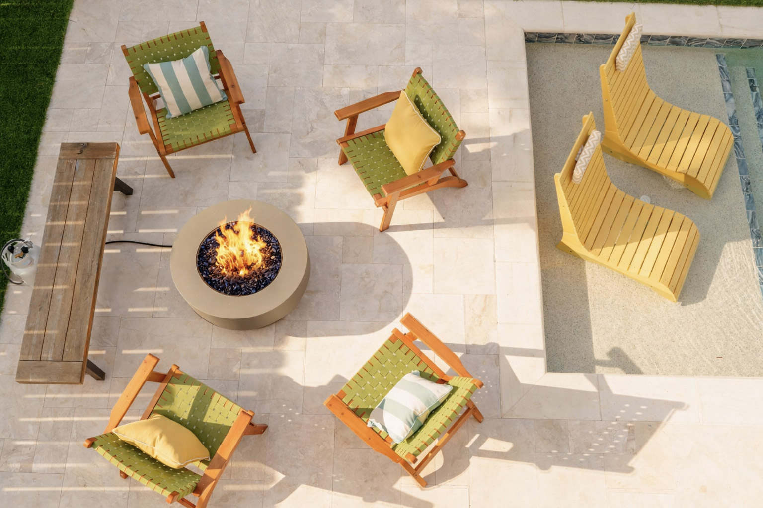 Fire pit and pool loungers at White Sands