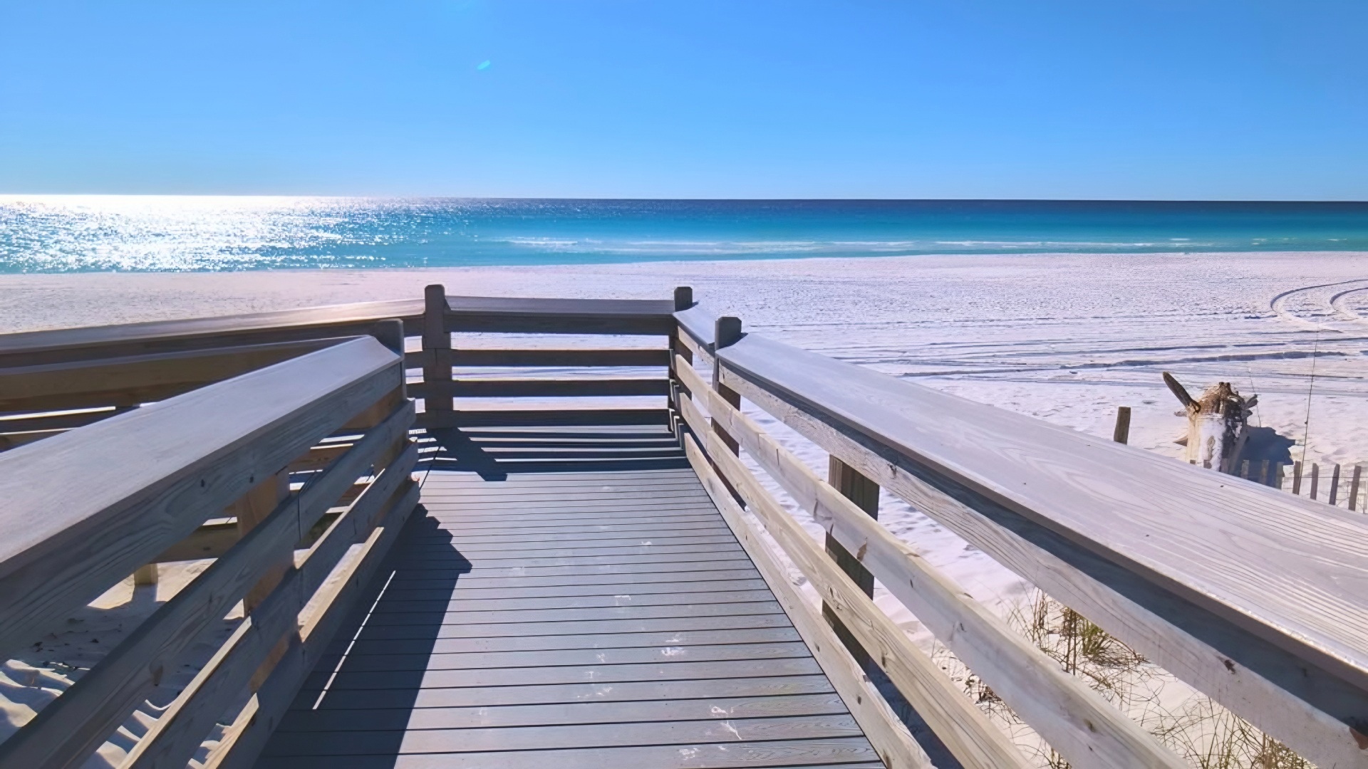 Boardwalk to white sand beach and teal waters - direct from condo, no steps