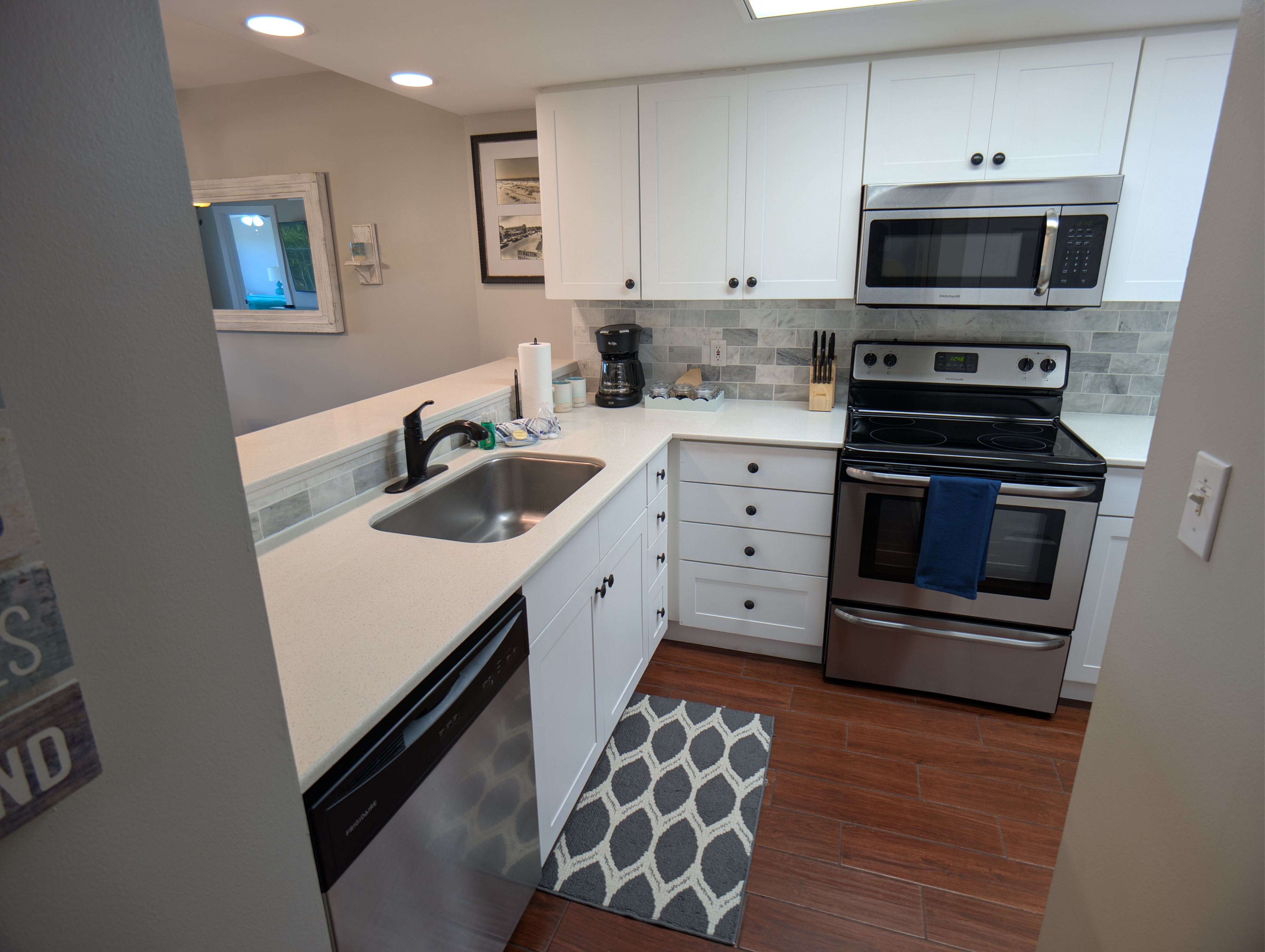 Modern kitchen with solid surfaces, stainless appliances, coffee station and much more.