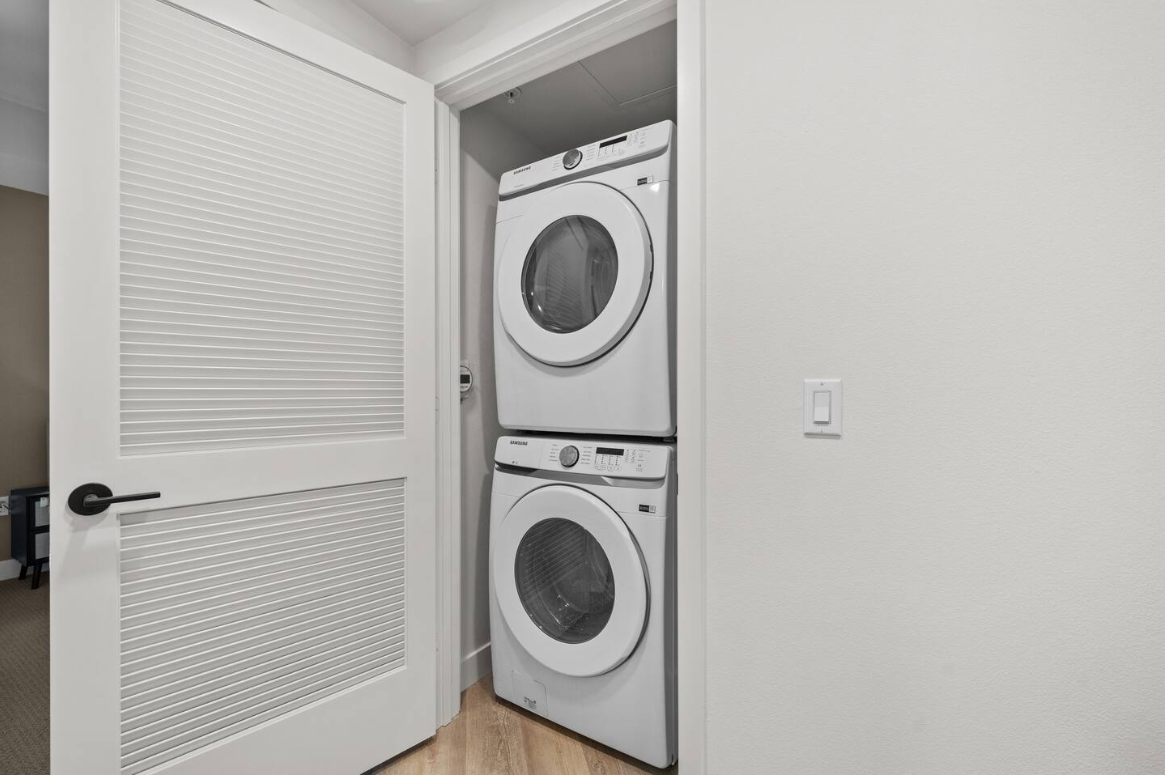 Convenient in-unit washer/dryer tucked into a sleek laundry closet