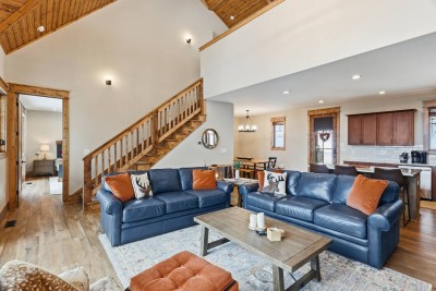 With vaulted ceilings and layered seating, this living room feels spacious yet cozy. It’s designed for gathering, relaxing, and making memories together.