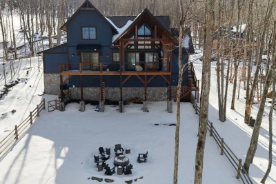 Tucked among the trees and blanketed in snow, this modern mountain retreat feels like your own private winter escape. The peaceful setting sets the tone for a cozy, unforgettable stay.