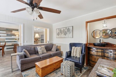 A cozy seating nook offers a quiet place to read, relax, or enjoy conversation, adding extra comfort and flexibility to the living space.