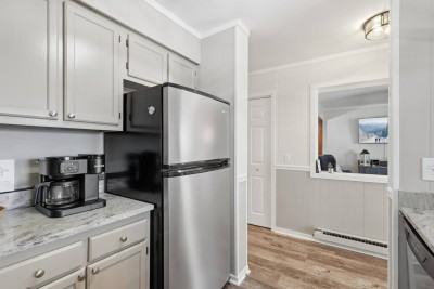 This well-organized kitchen layout allows for smooth movement and easy access, making meal preparation stress-free and enjoyable for solo cooks or groups.