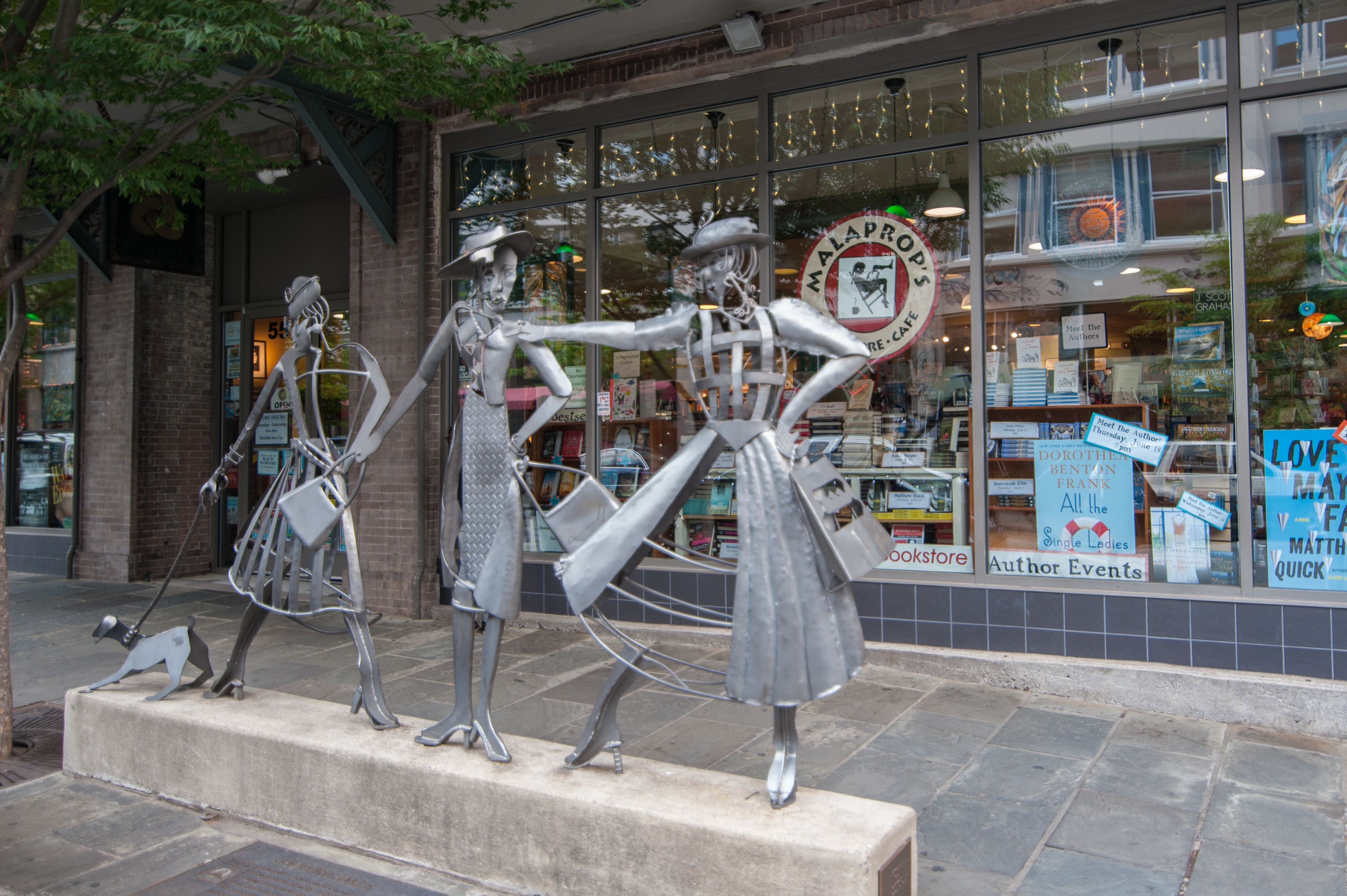 Art-filled city streetscape with bookstore charm and walkable appeal