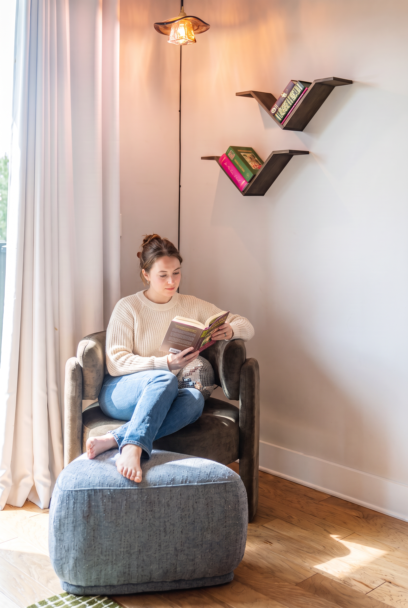 Cozy sunlit reading nook with plush seating and stylish modern accents
