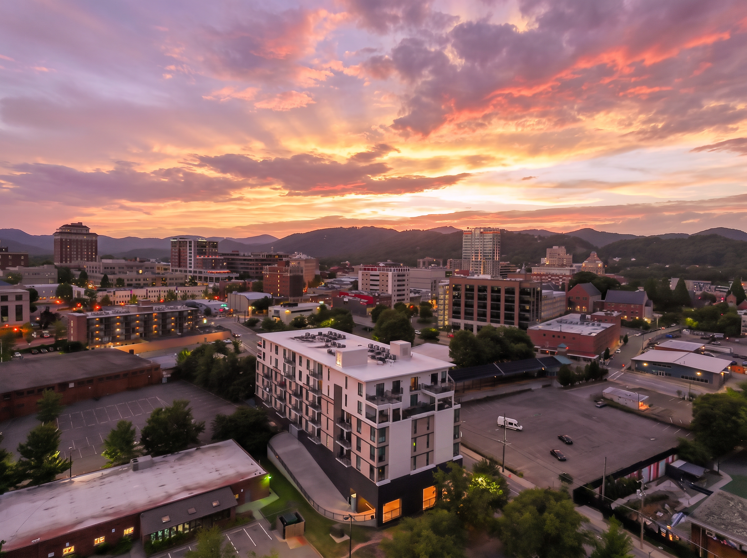 Downtown skyline and mountain views under a stunning sunset sky