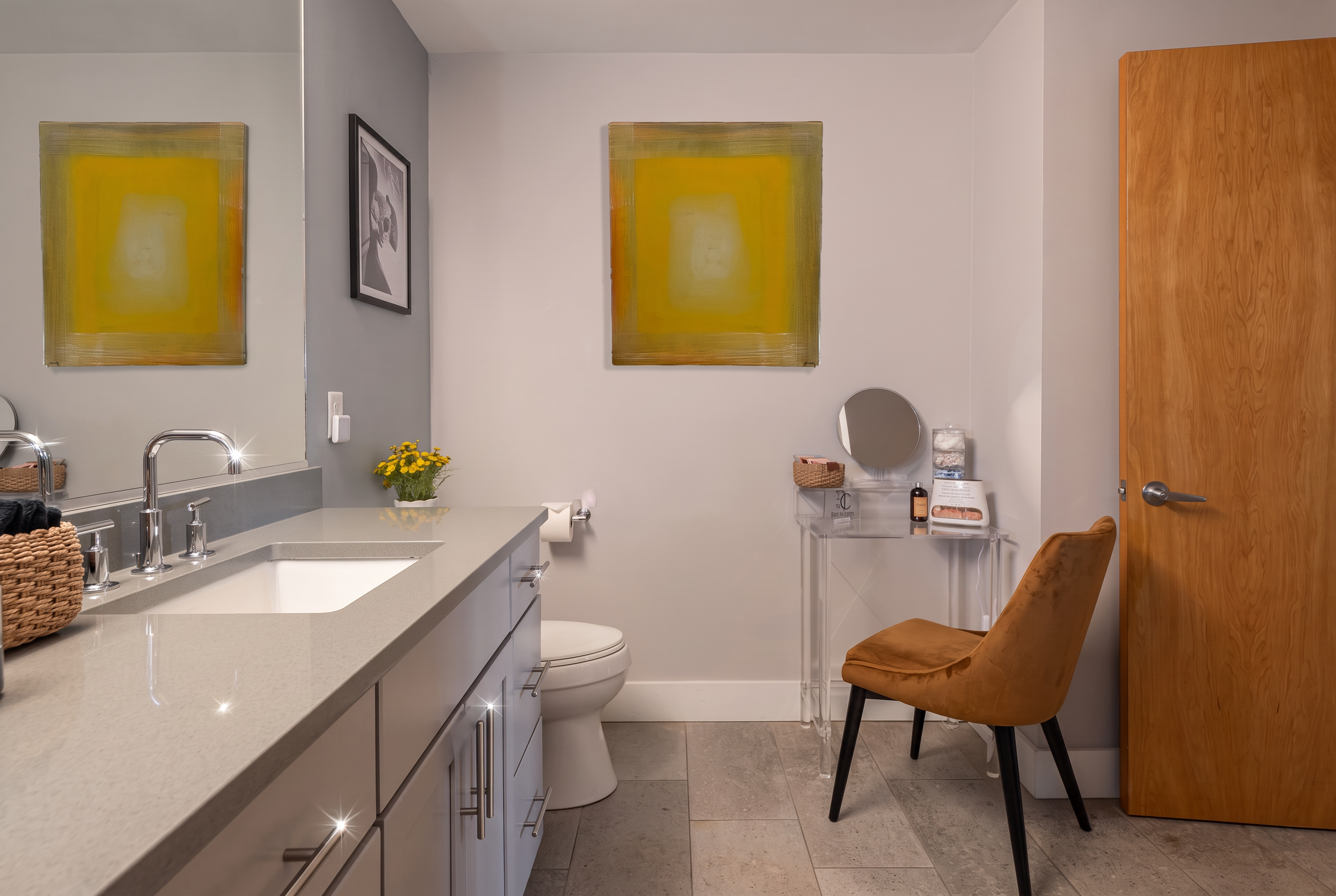 Bright modern bathroom with spacious vanity and stylish getting-ready nook