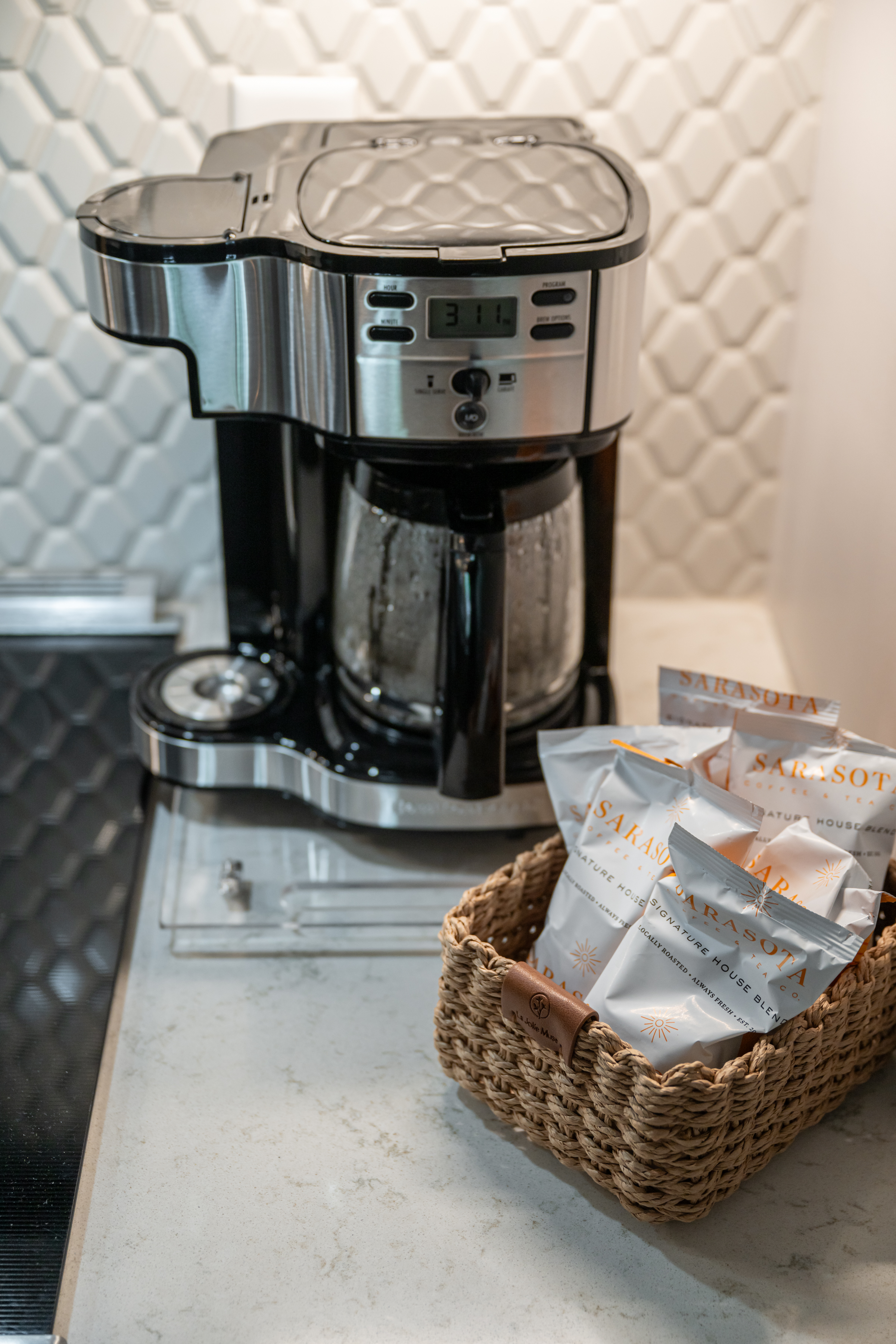 Guest-ready coffee station with stocked essentials and stylish finishes