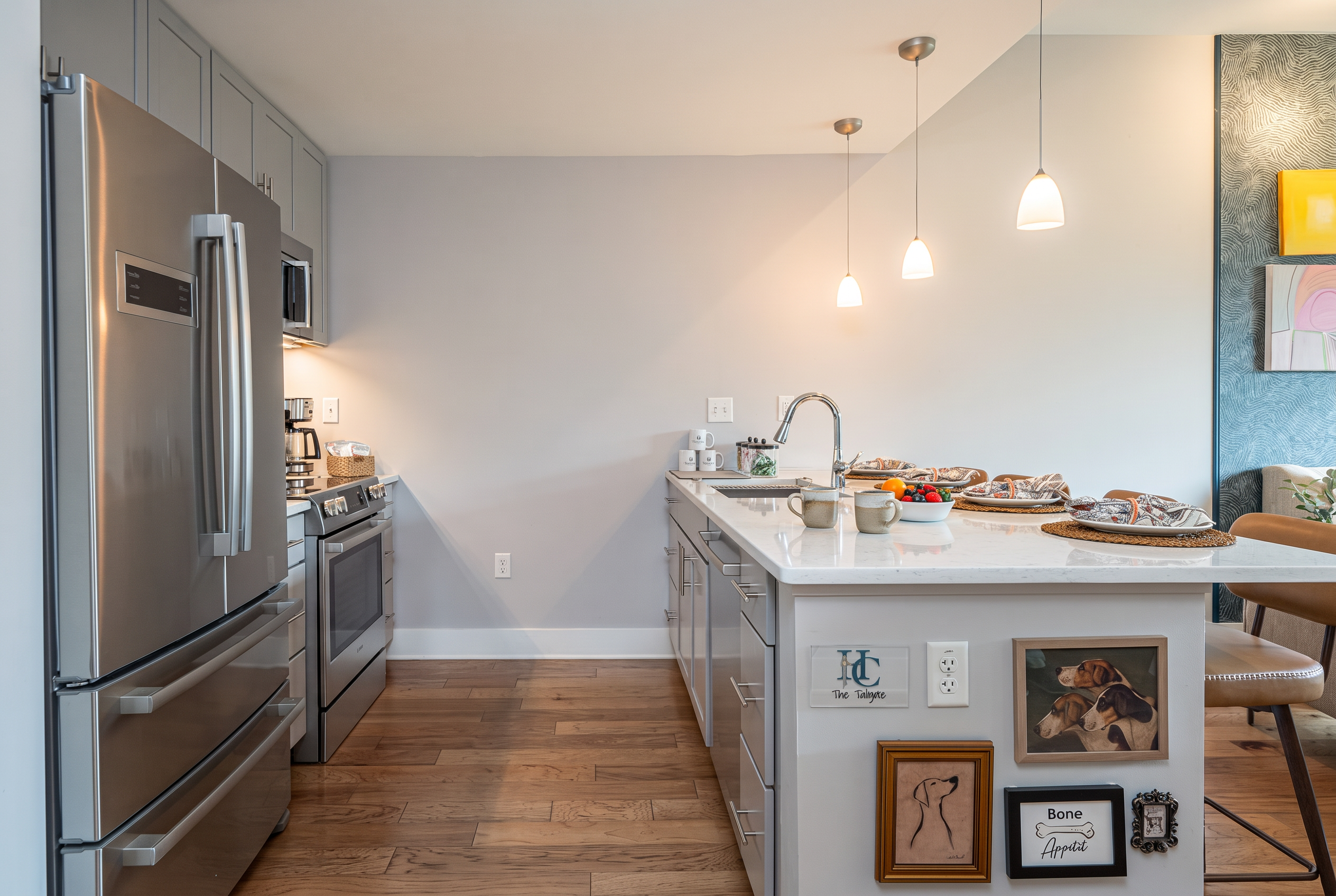 Modern chef’s kitchen with island seating and sleek stainless appliances