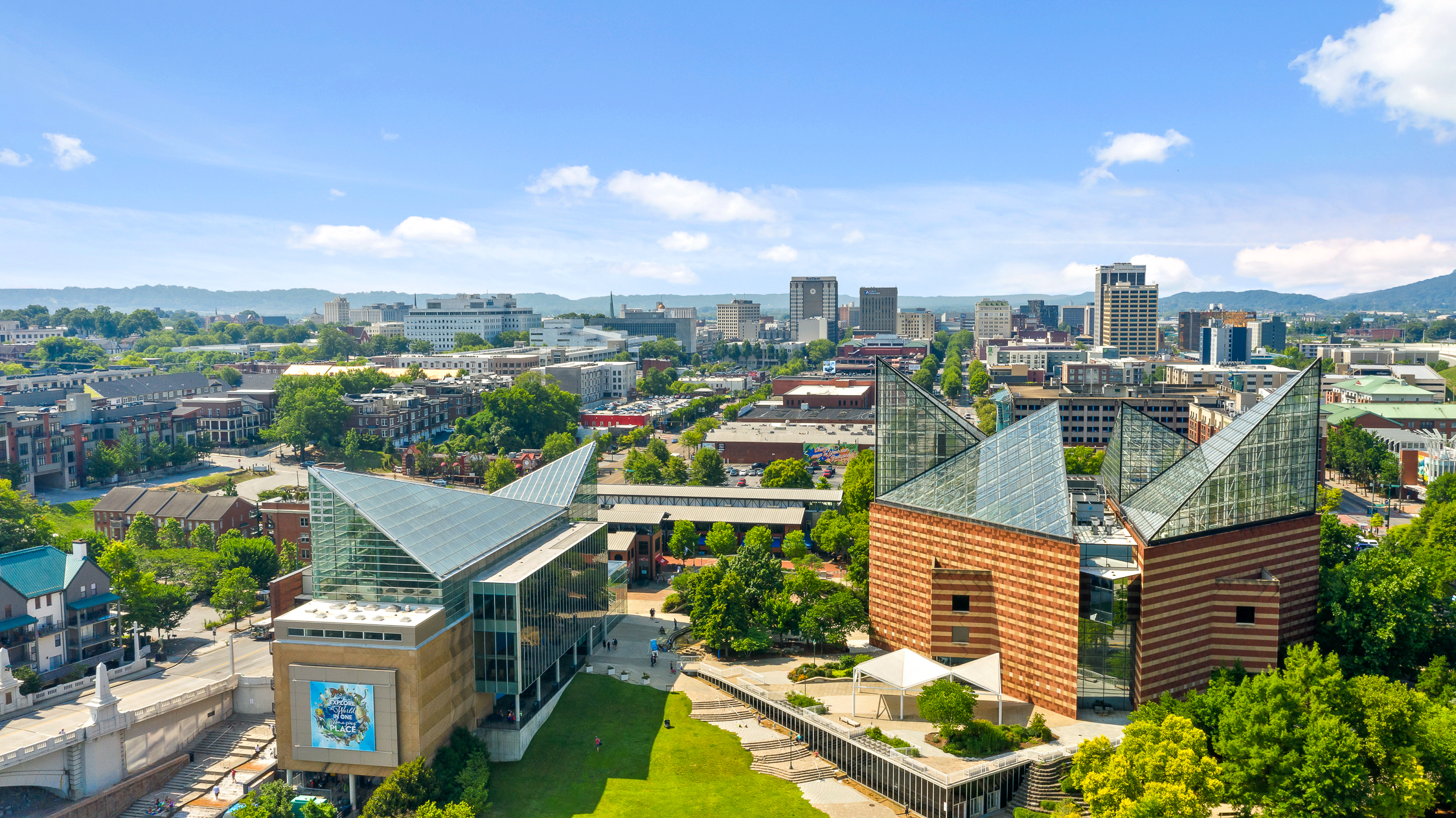 Sweeping downtown views with iconic architecture and scenic hill backdrop