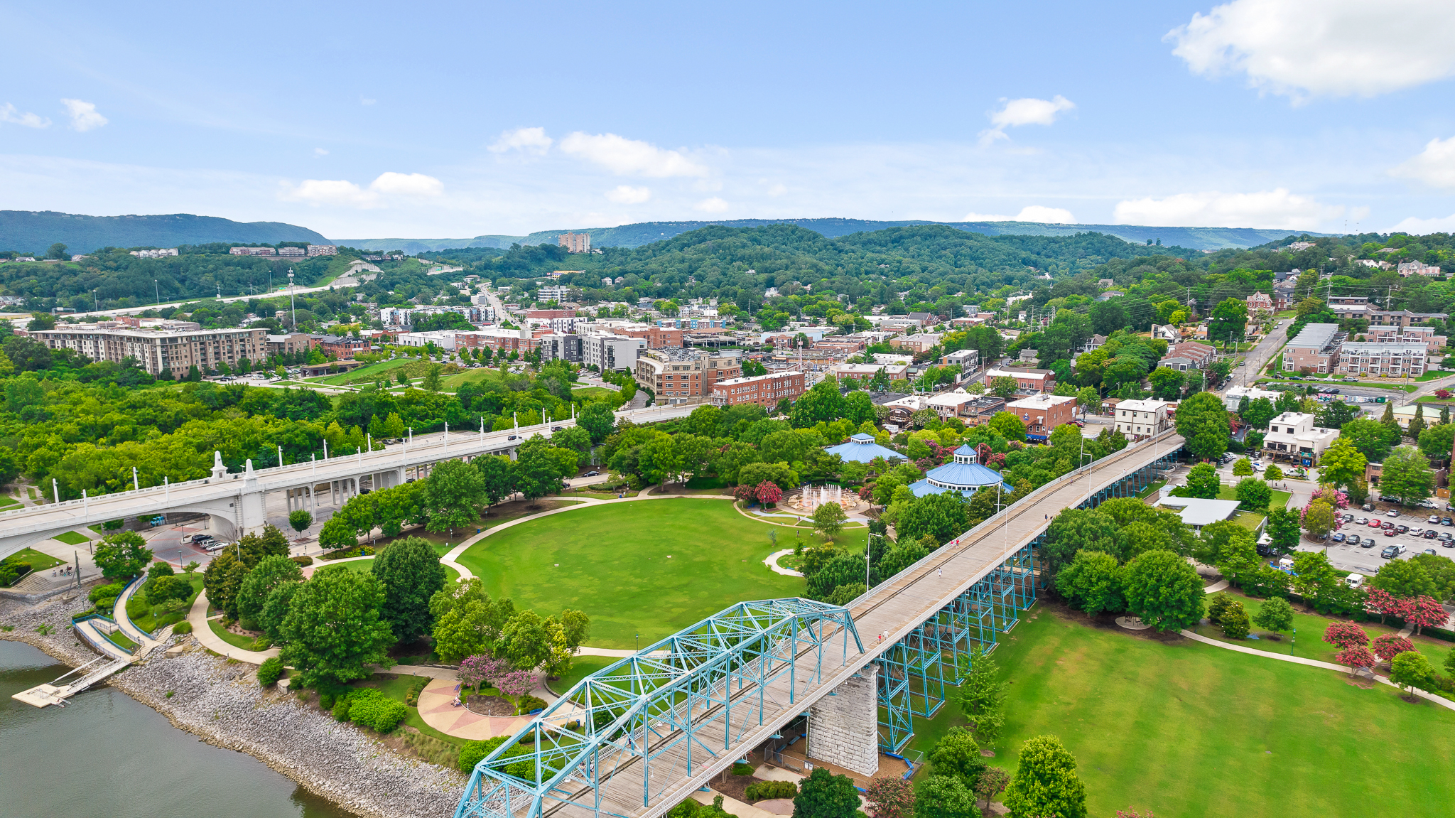Scenic riverfront views with bridges, park space, and charming downtown access