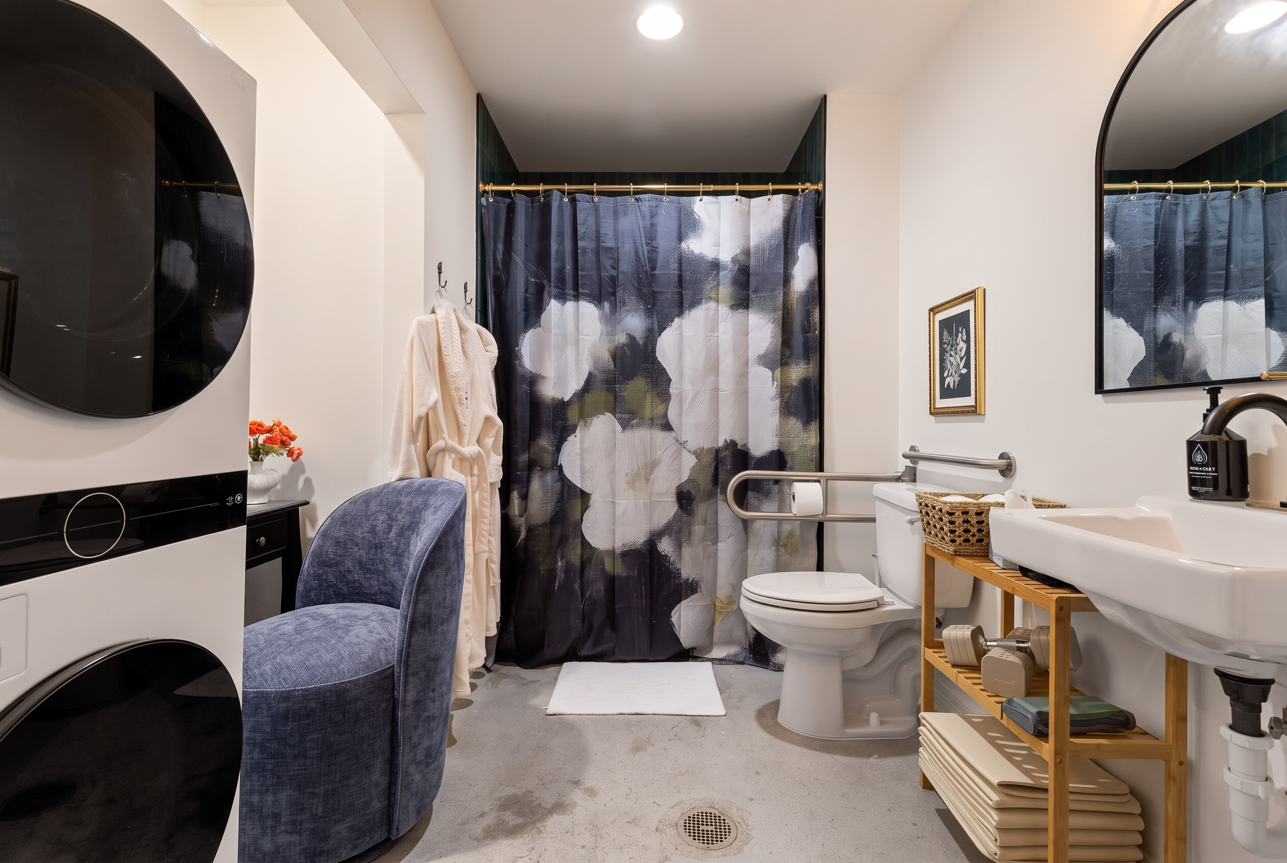 Stylish spa-like bathroom with in-unit laundry and thoughtful guest touches