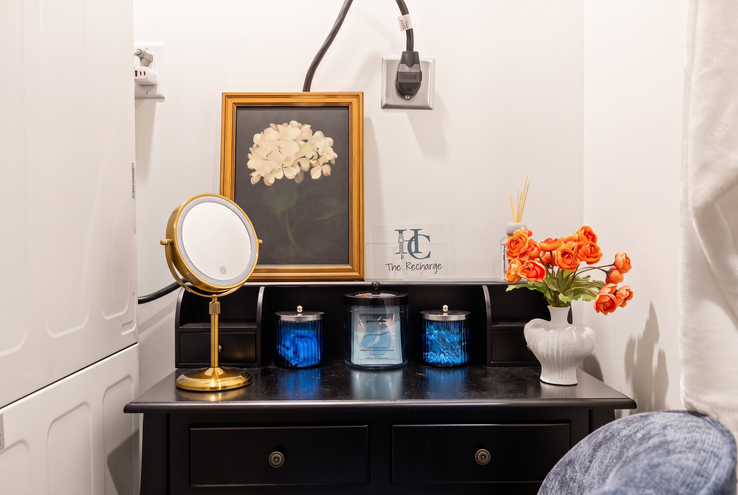 Chic vanity nook with in-unit laundry and elegant decorative touches