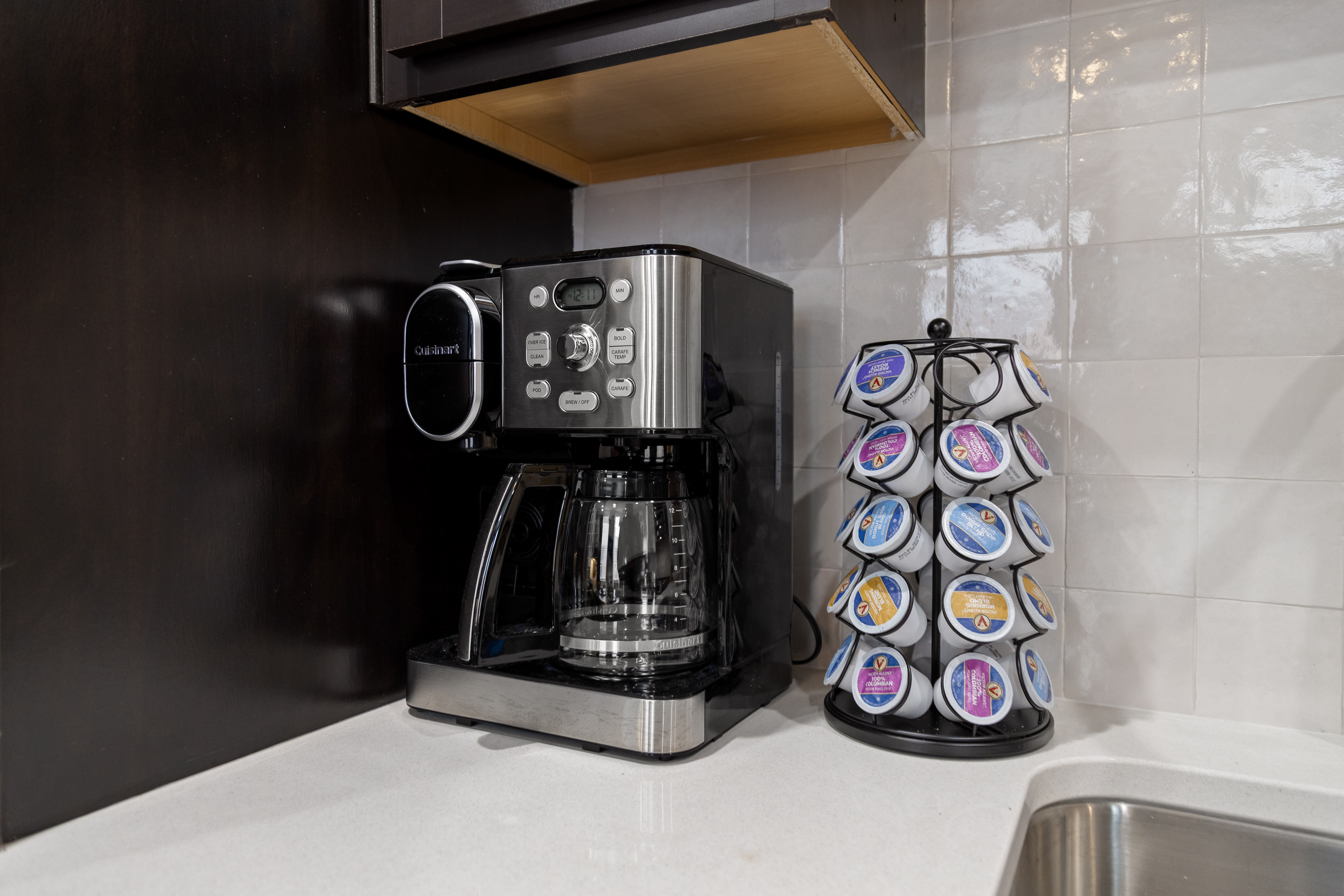 Guest-ready coffee station with drip maker, pod brewer, and assorted pods