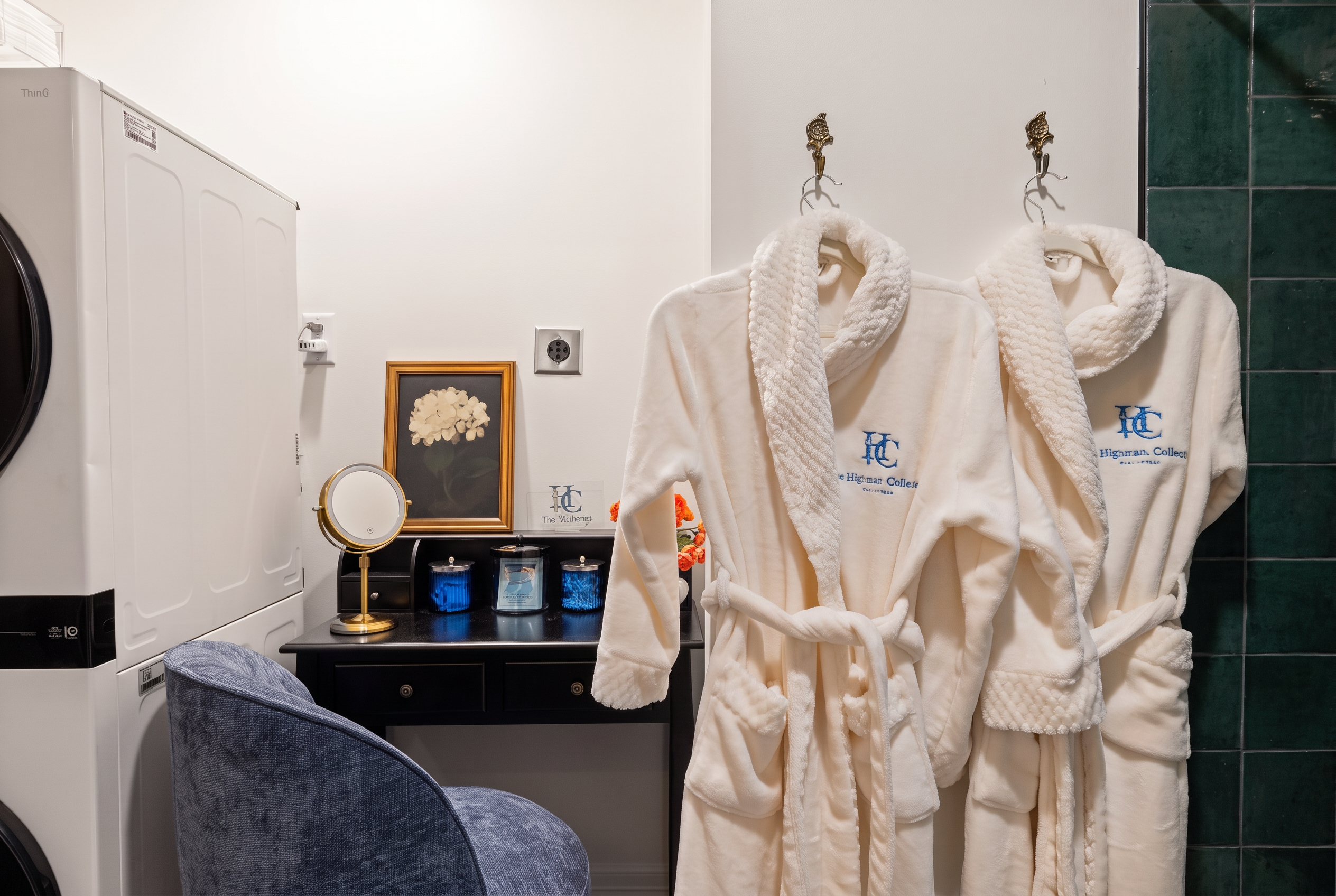 Boutique-style laundry nook with plush robes and vanity area