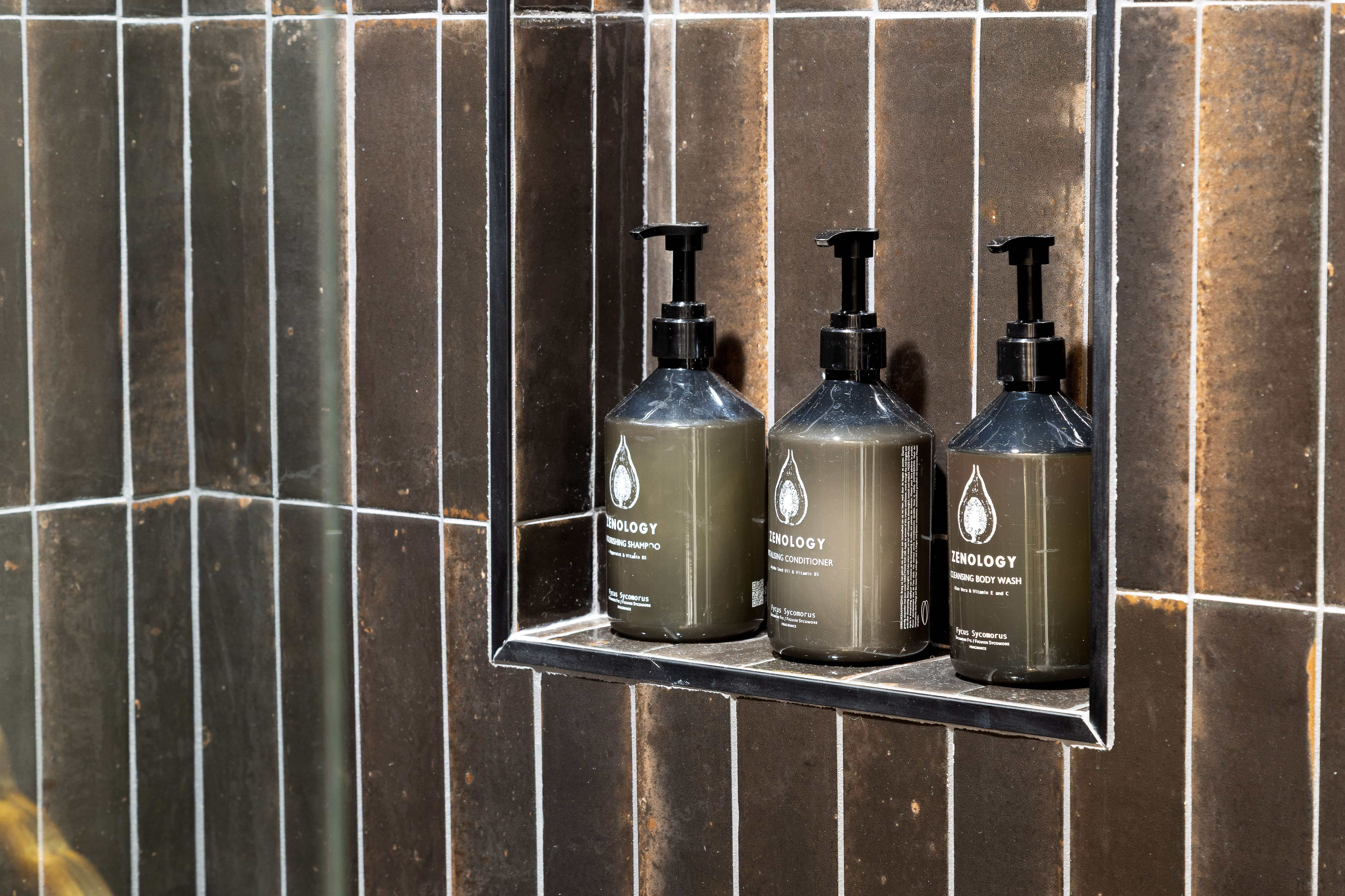 Spa-like shower with premium toiletries and sleek modern tile