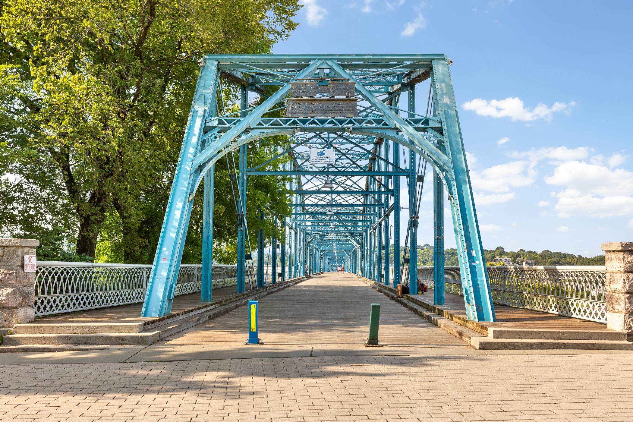 Iconic blue truss bridge nearby—perfect for scenic walks and photos