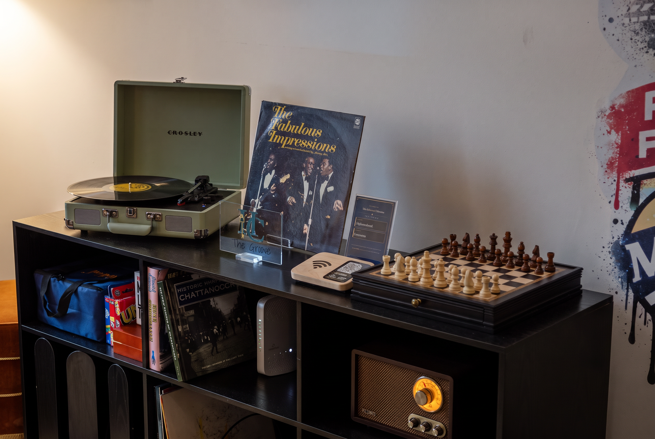 Cozy entertainment corner with record player, chess set, and retro charm