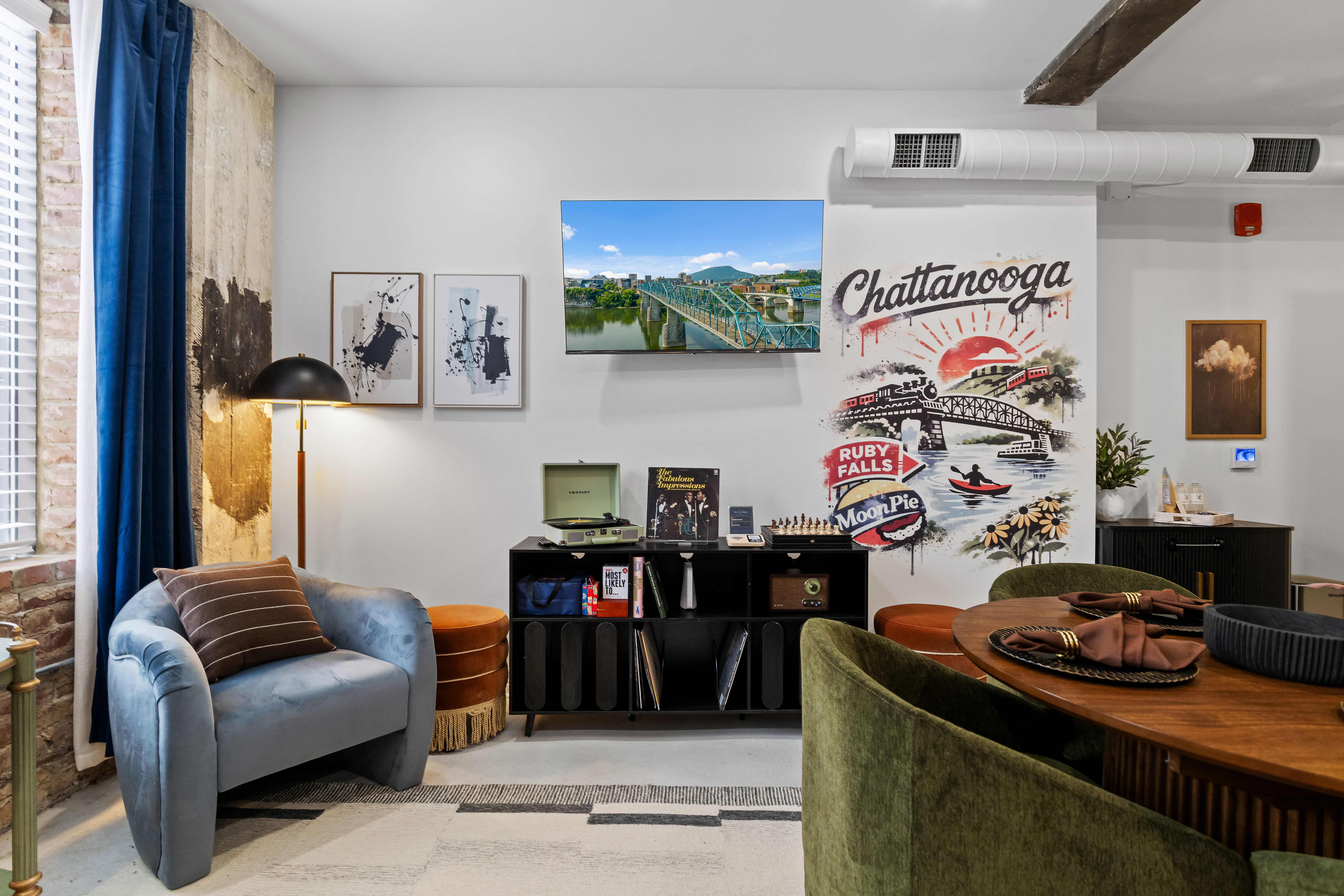 Stylish Chattanooga-inspired lounge with dining space and bold local flair