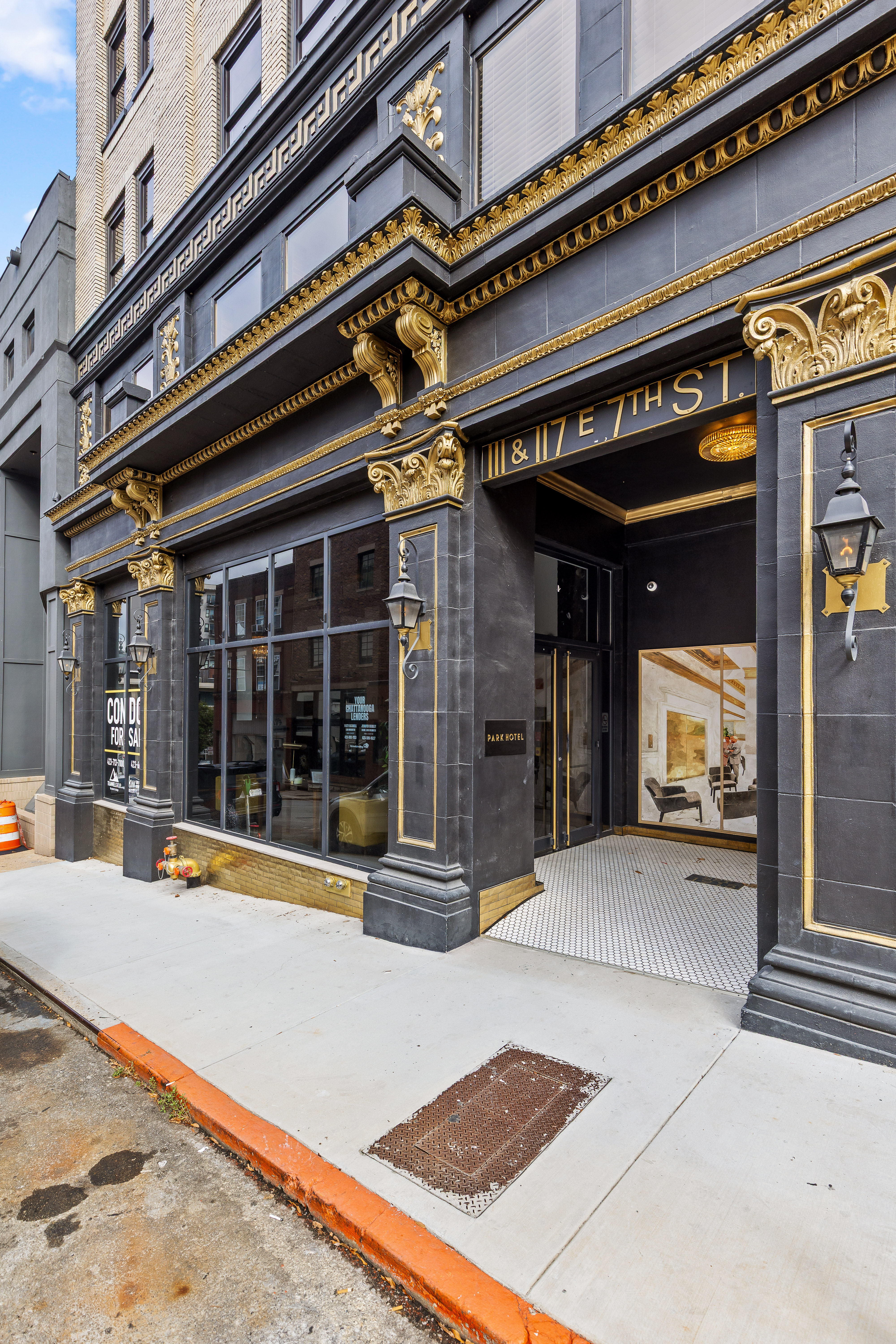 Grand black-and-gold entry with elegant historic character