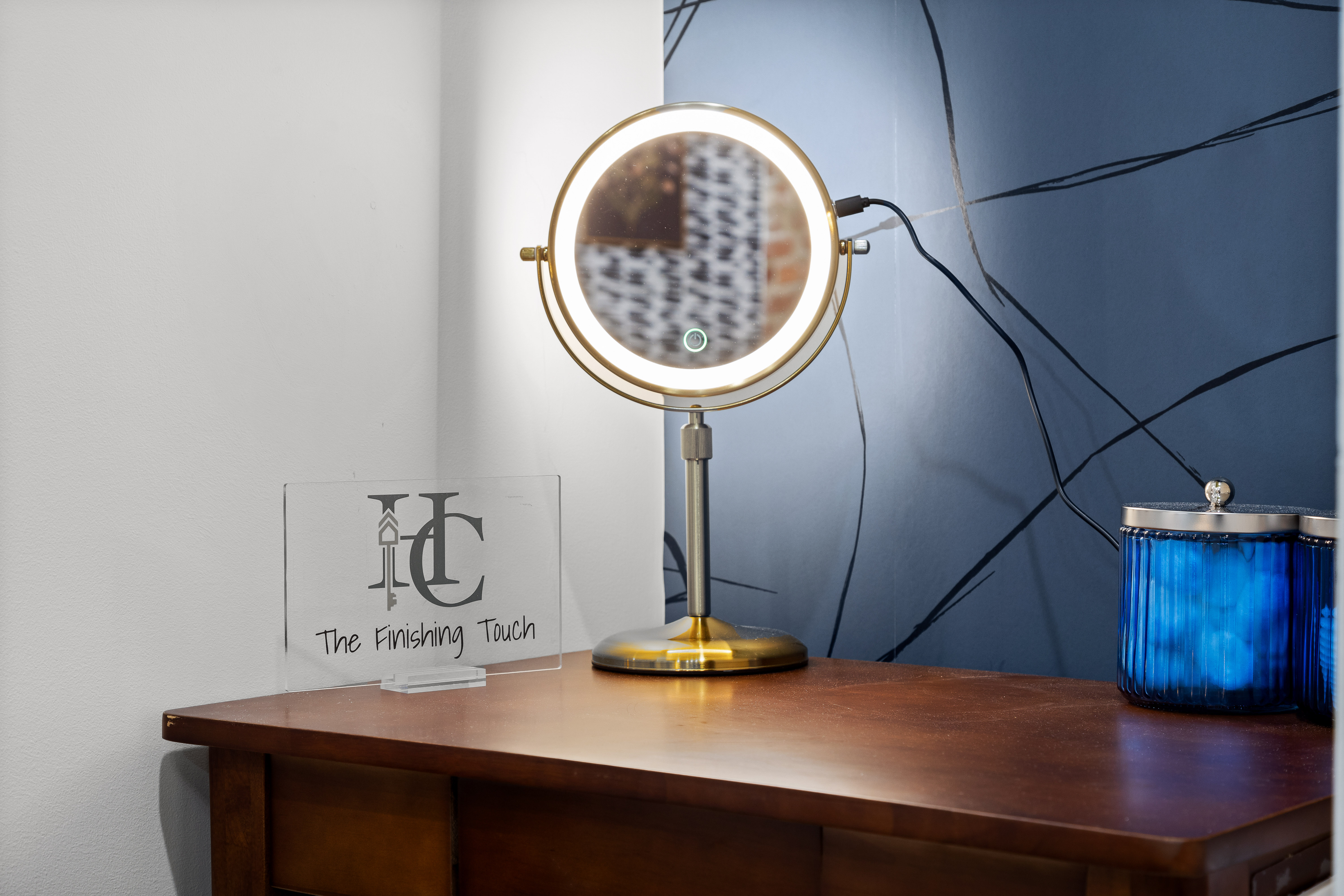 Chic vanity nook with lighted mirror and stylish modern accents