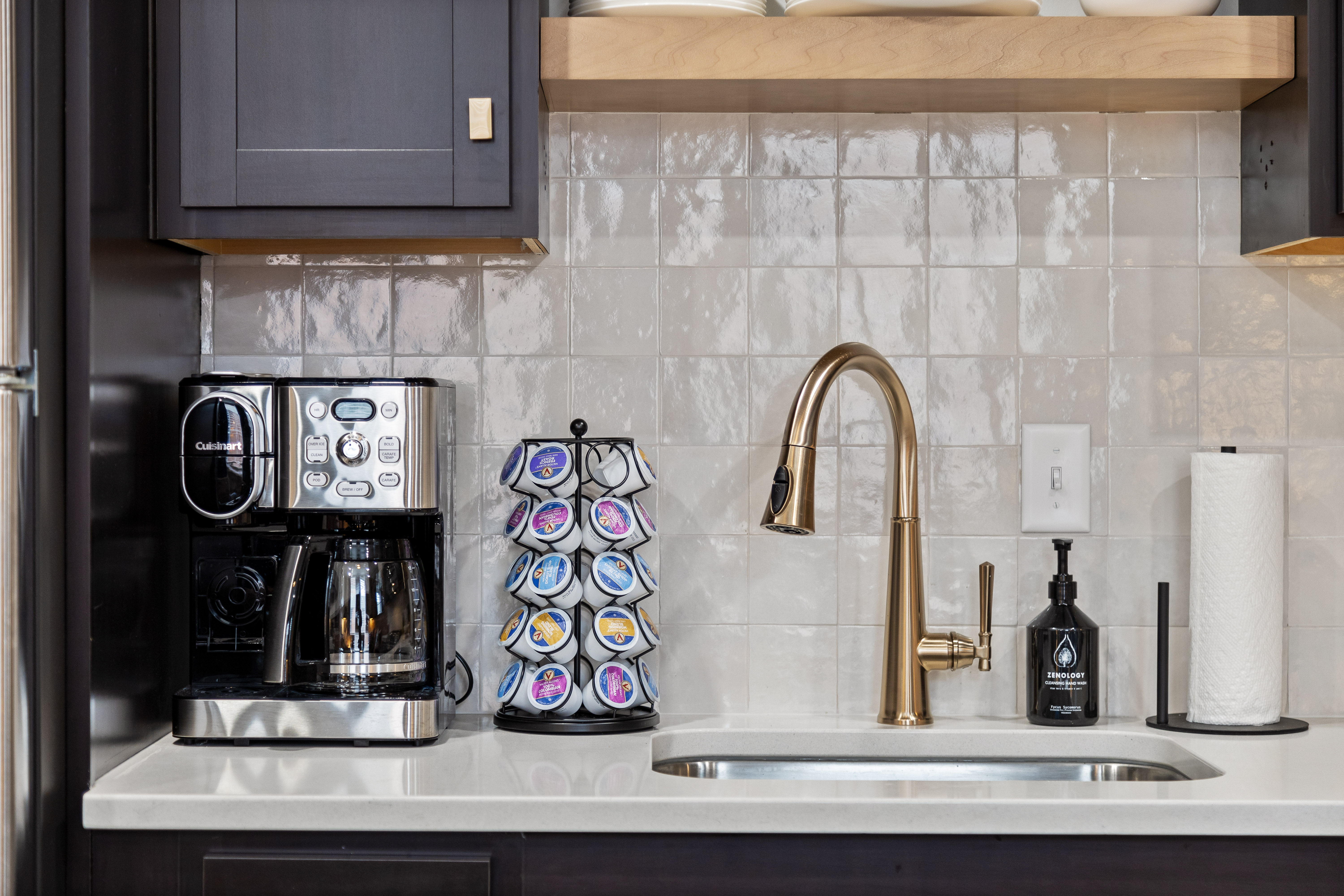 Modern kitchen coffee station with sleek sink and stylish finishes