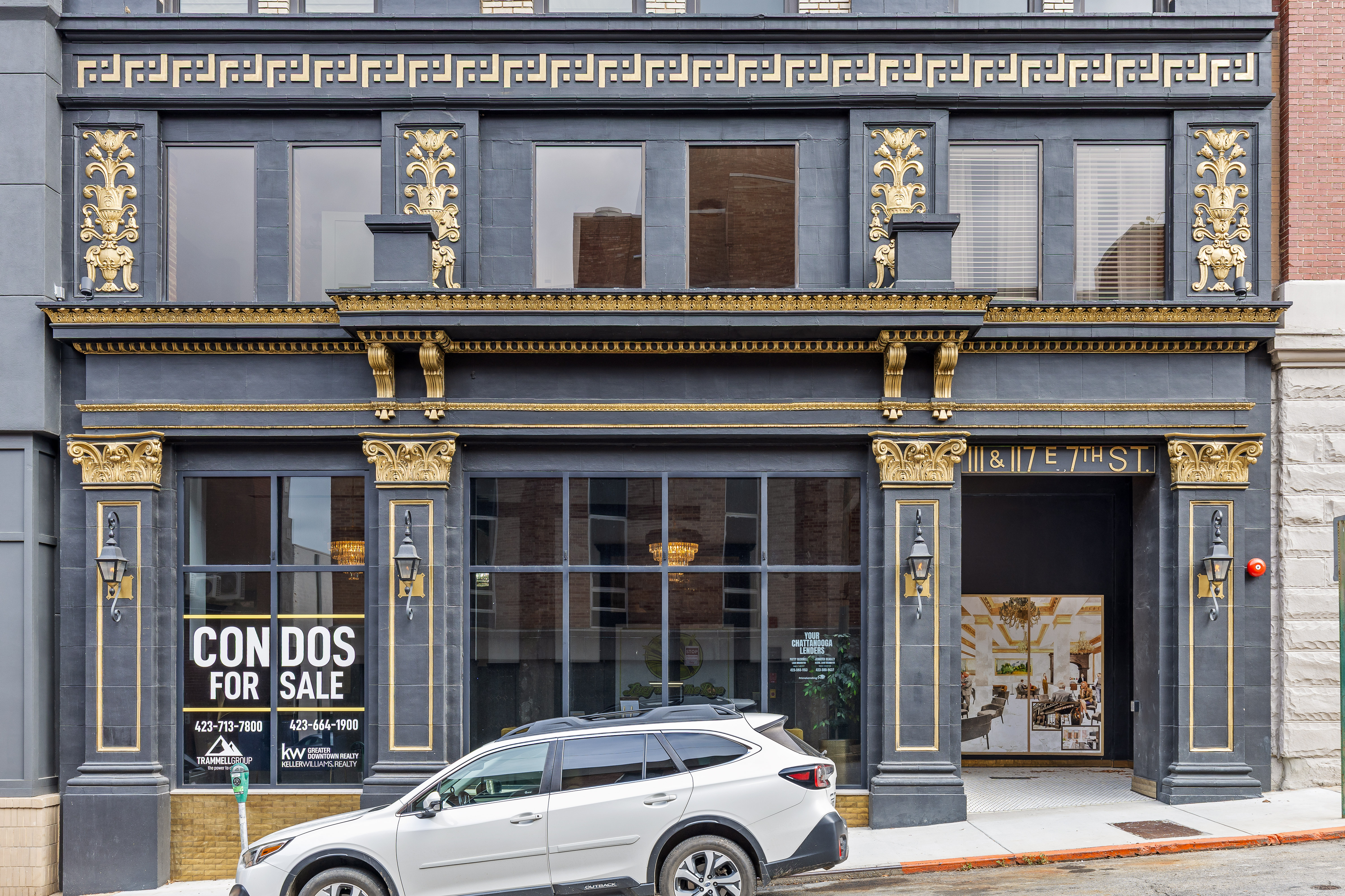 Elegant historic facade with striking gold accents and upscale city appeal