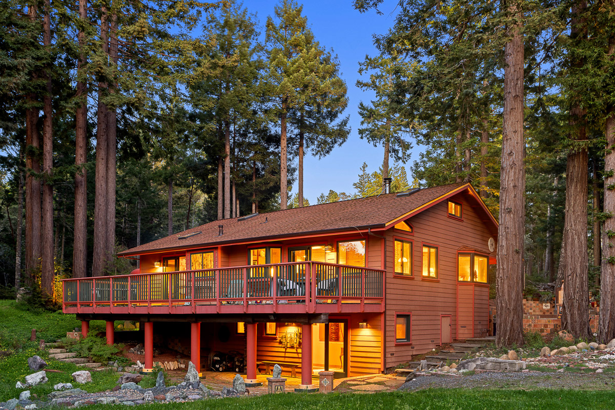Cozy redwood retreat with wraparound deck and tranquil forest views